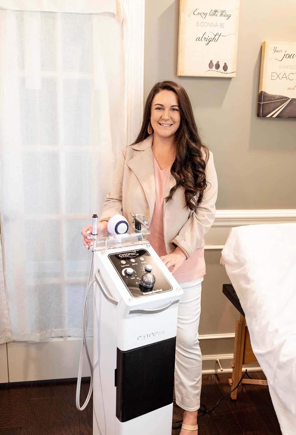 a woman standing in front of a machine